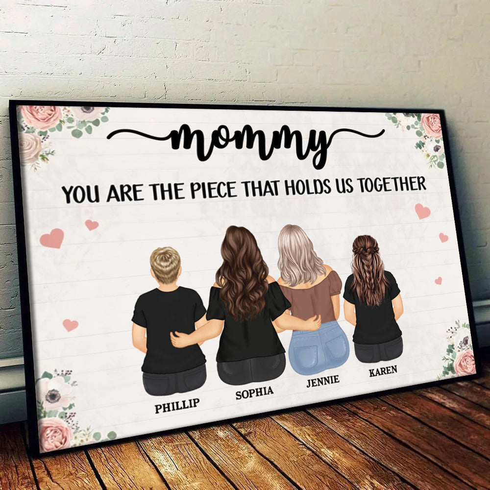 Personalized The Piece That Holds Us Together poster, a woman hanging the framed print on a wall