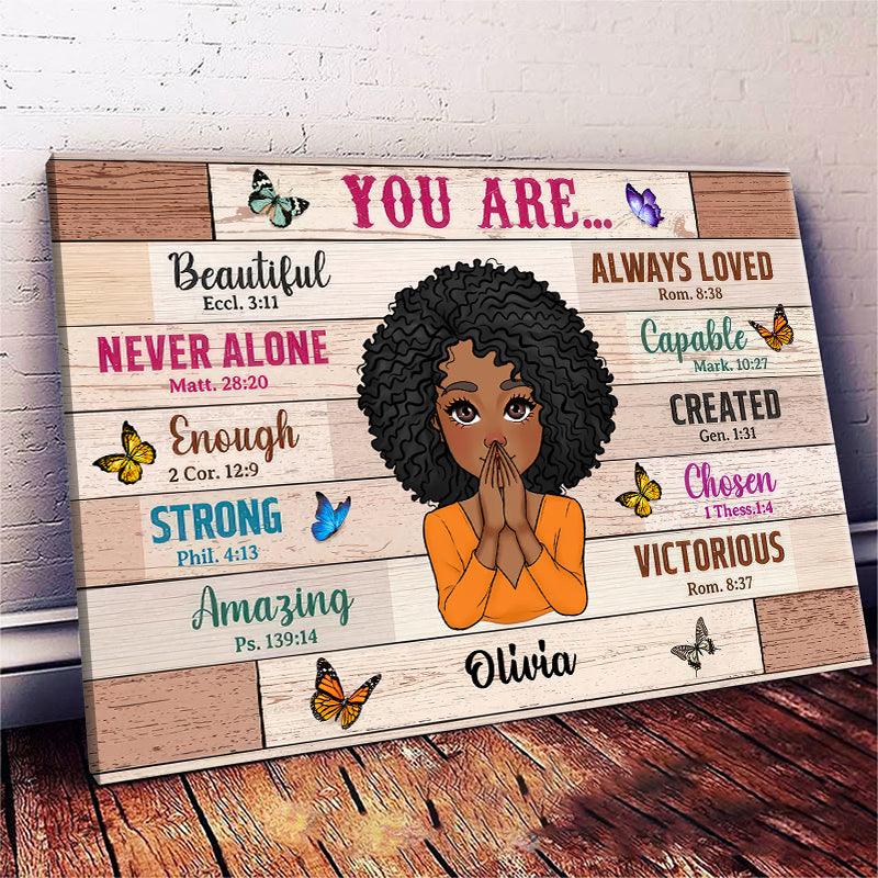Personalized You Are Beautiful Woman canvas print, a woman hanging the framed print on a wall