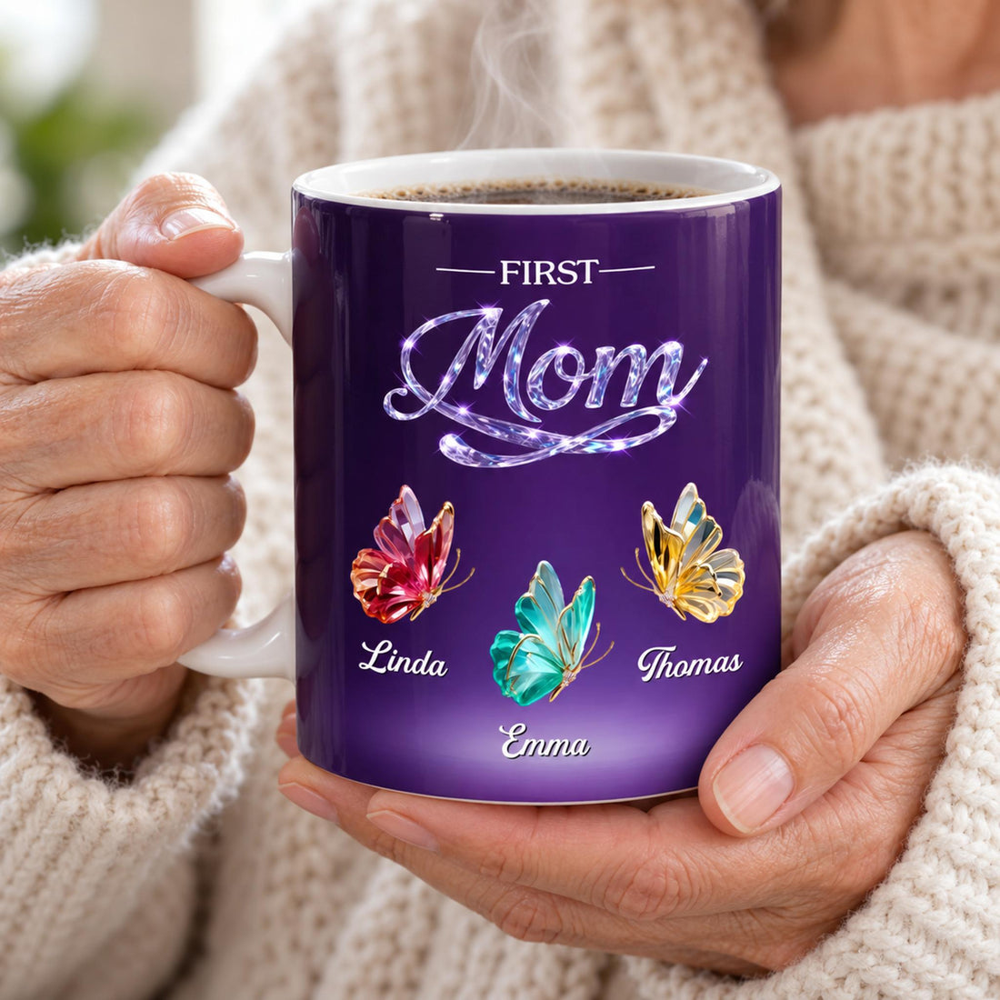 Grandma holding personalized First Mom butterfly ceramic mug with steaming coffee