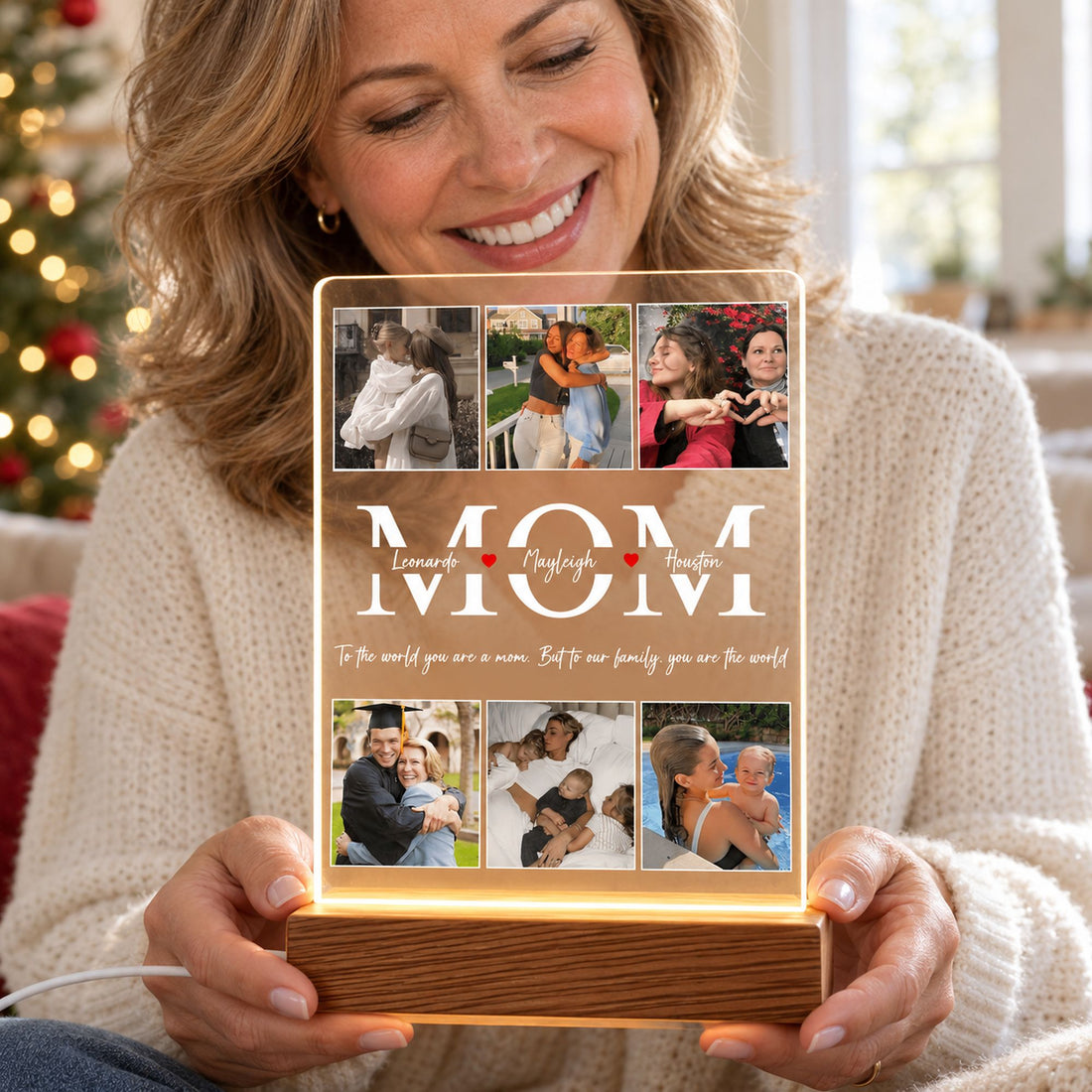 Mom holding personalized MOM photo acrylic LED night light with wooden base in bright living room