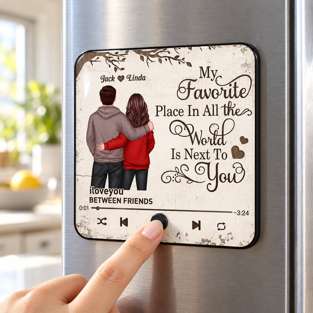 Couple personalized music fridge magnet stuck on a stainless steel refrigerator door being pressed