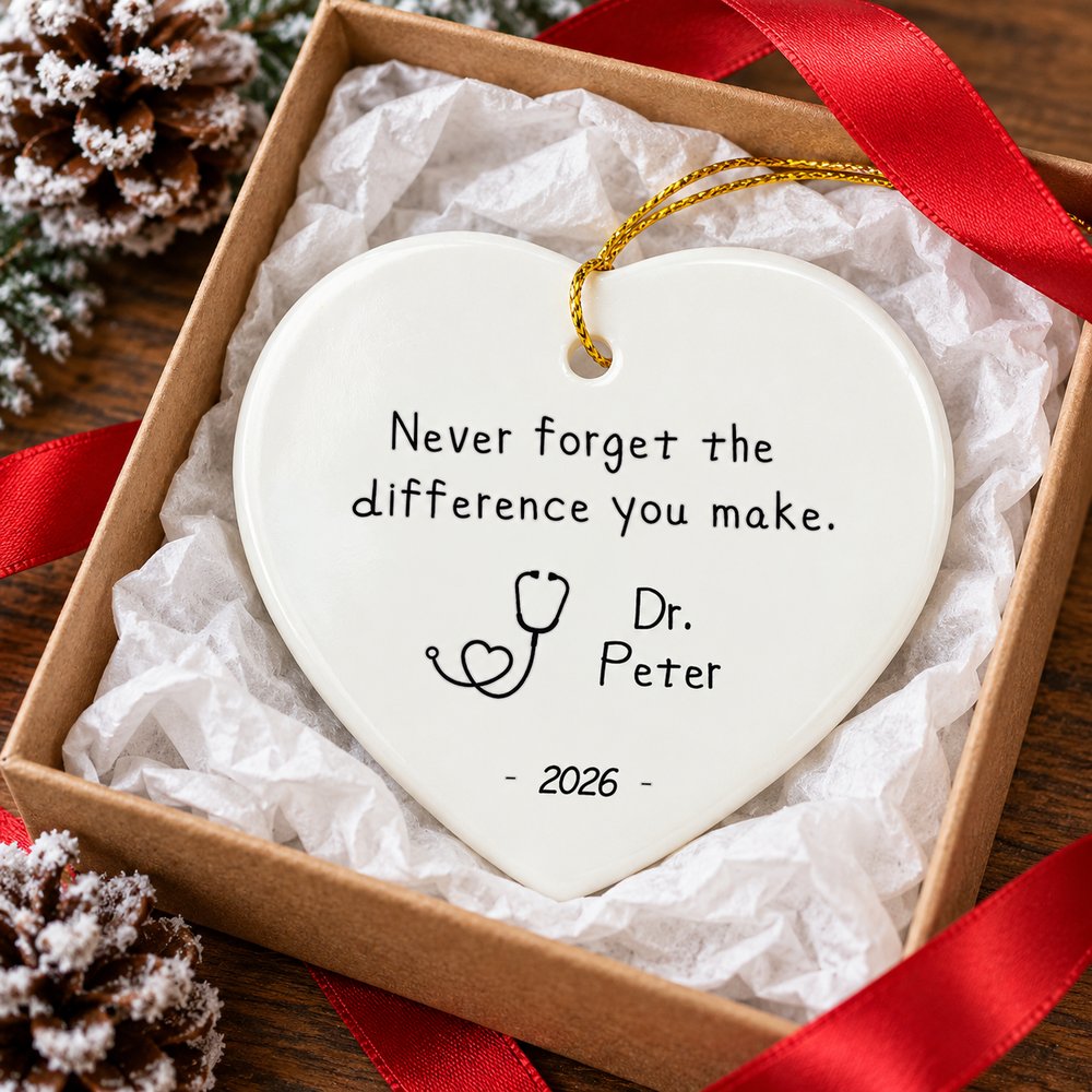 Nurse appreciation heart ceramic ornament presented in an open Christmas gift box with ribbon