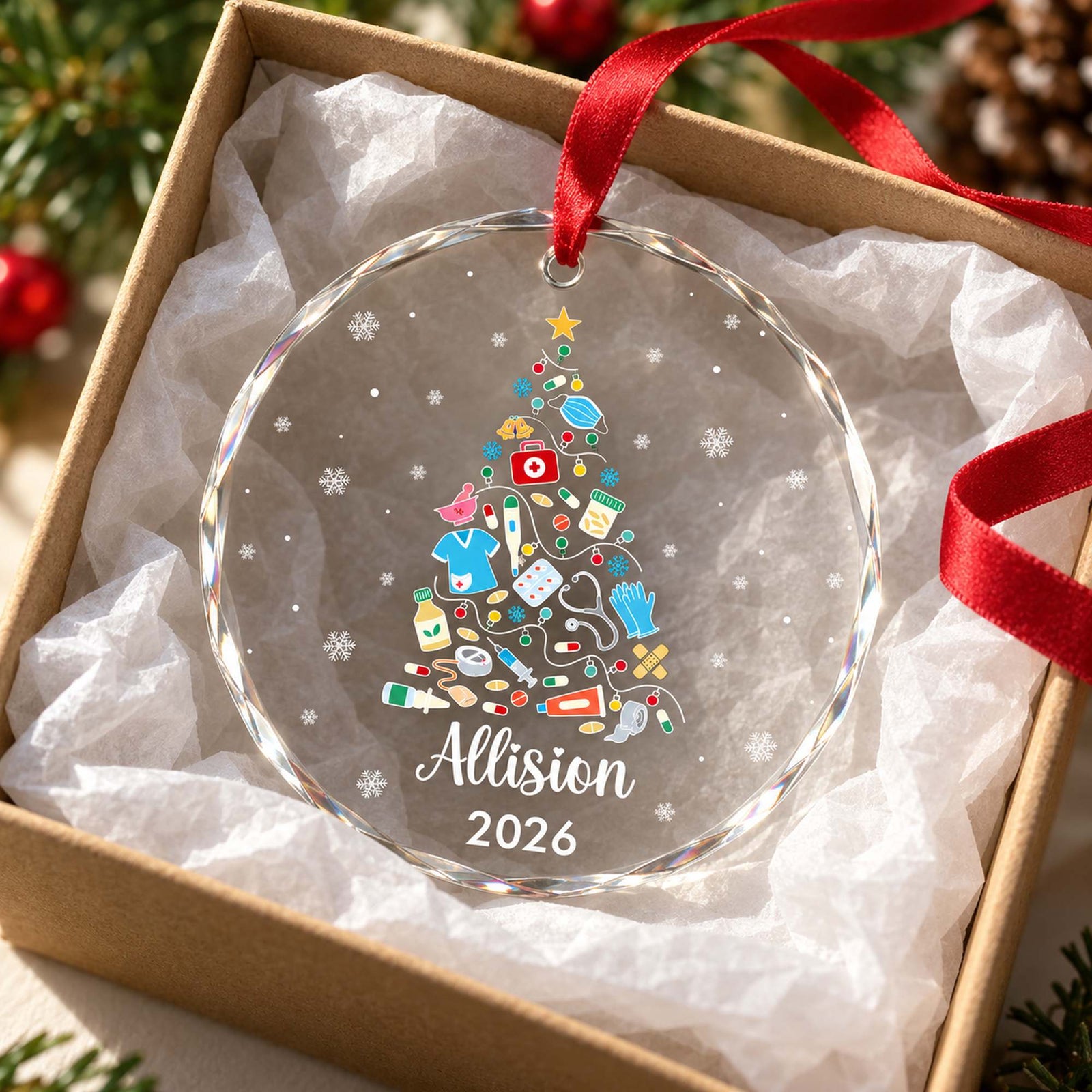 Personalized nurse glass ornament nestled in an open gift box with white tissue paper