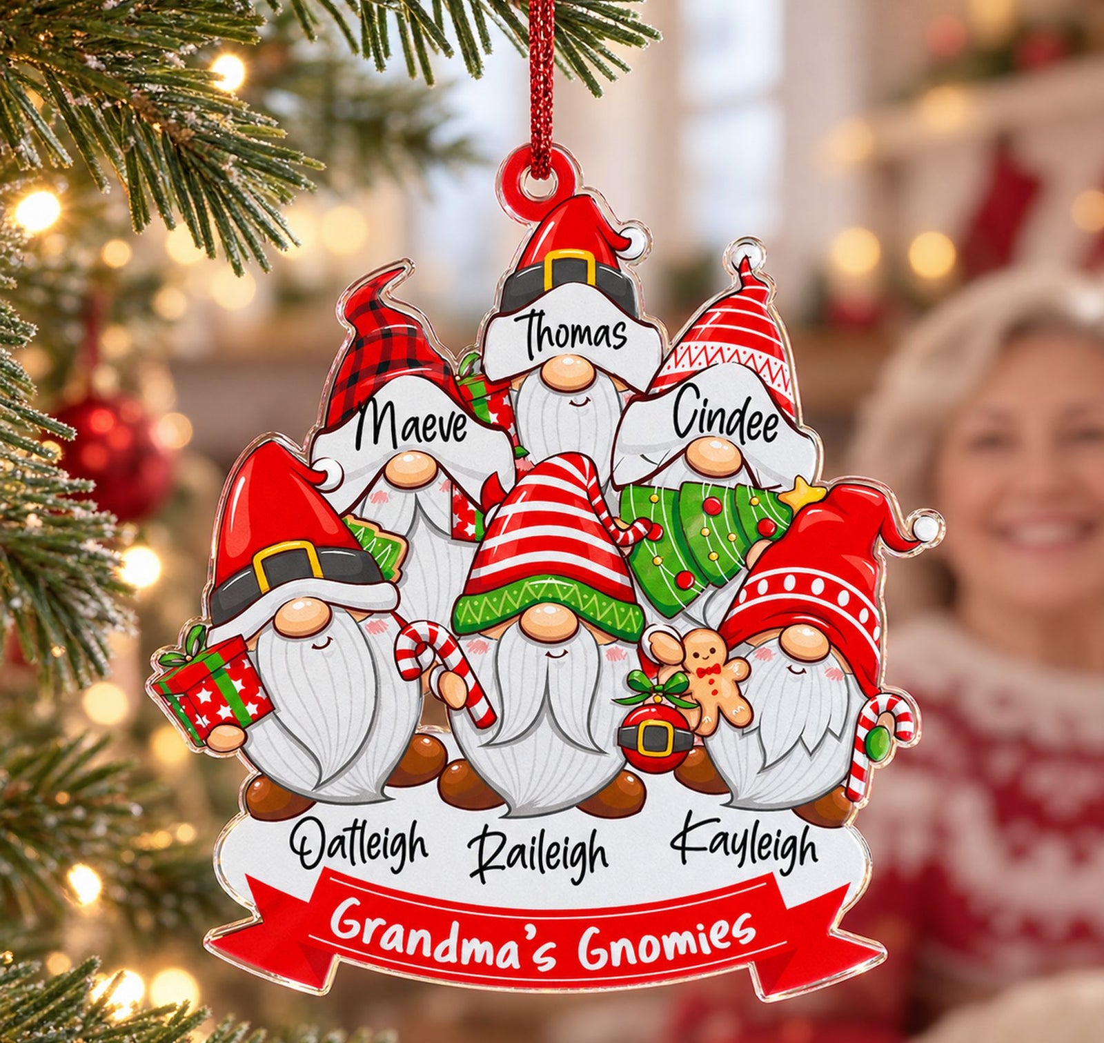 Close-up detail of glossy clear acrylic print and laser-cut edges on Christmas family gnome ornament