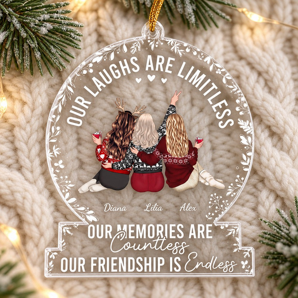 Personalized best friends acrylic ornament lying flat on a cream knit blanket with pine sprigs