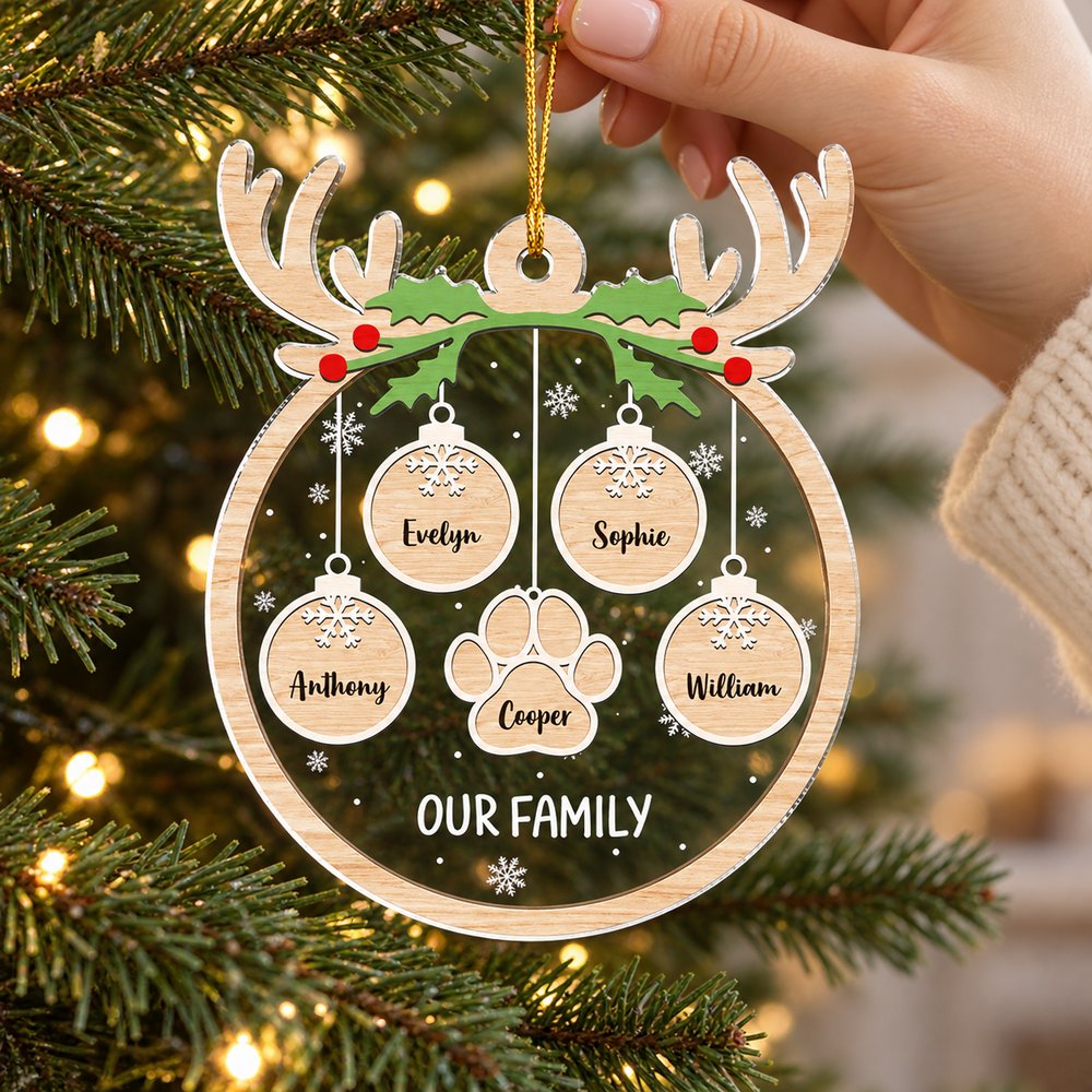 Hanging personalized family and pet paw acrylic ornament on a Christmas tree branch