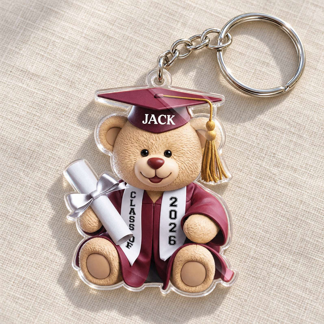 Macro closeup of glossy 3mm acrylic edge and UV print on graduation teddy bear keychain