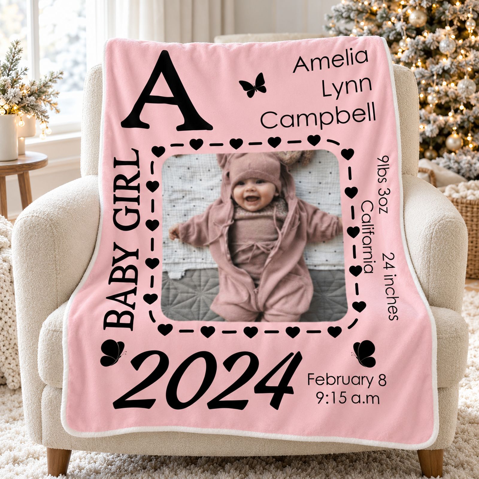Customized newborn photo blanket draped on a nursery armchair near a softly lit Christmas tree