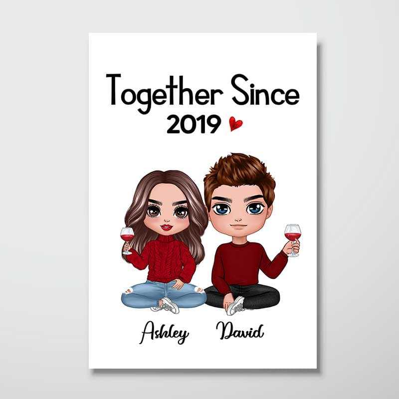 Personalized Doll Couple Sitting poster, a woman hanging the framed print on a wall