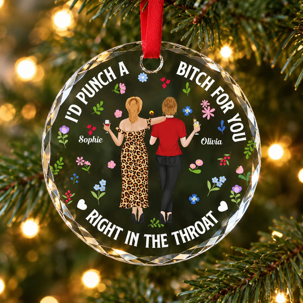 Personalized Punch Bitch Besties circle glass ornament hanging on a Christmas tree branch