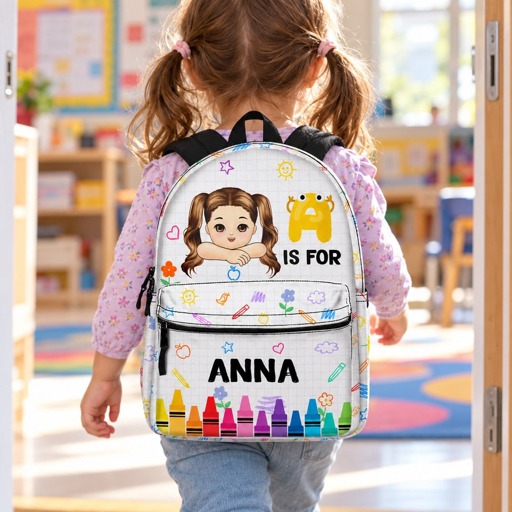 Preschool girl wearing personalized Anna crayon backpack walking into school classroom