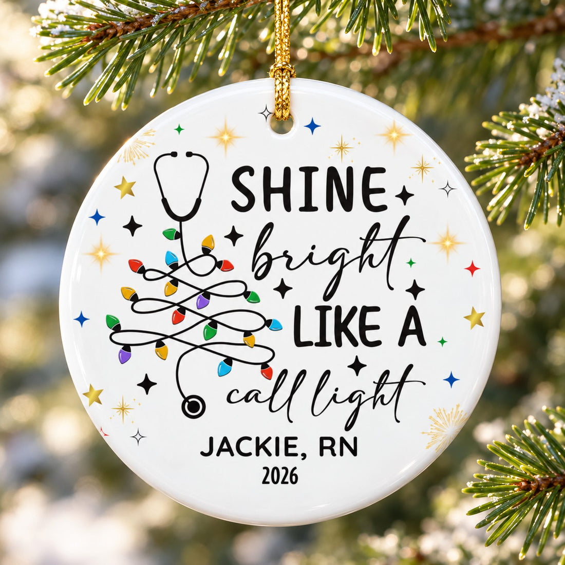Close-up detail of glossy ceramic nurse ornament showing stethoscope tree print and gold cord