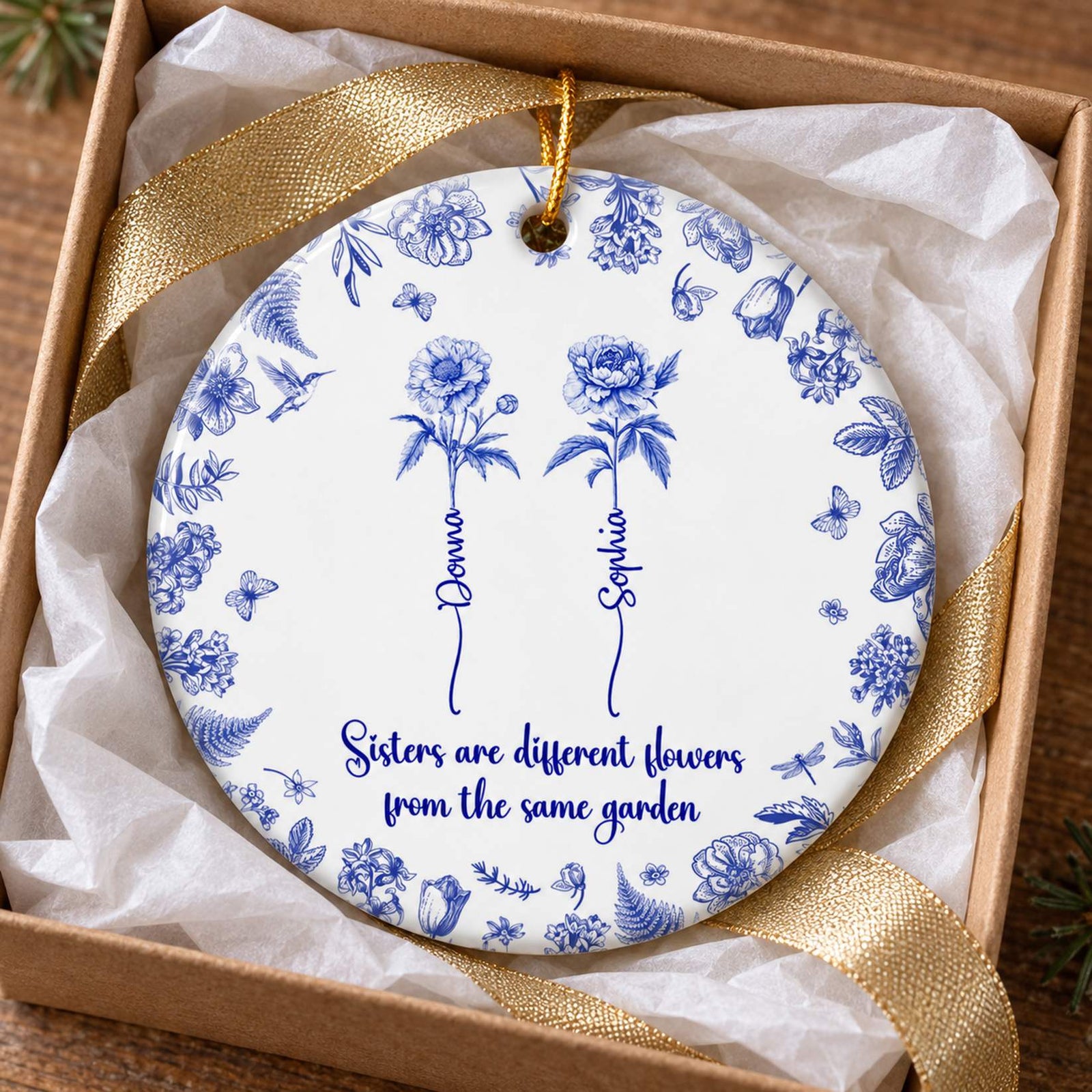 Personalized sisters Toile De Jouy ceramic ornament nestled in a white tissue-lined gift box