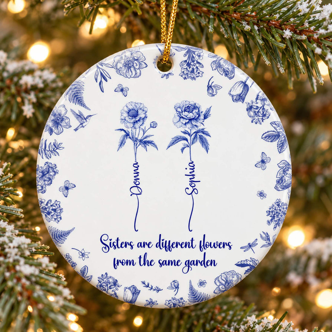 Close-up detail of blue Toile de Jouy floral print and personalized stem names on ceramic ornament