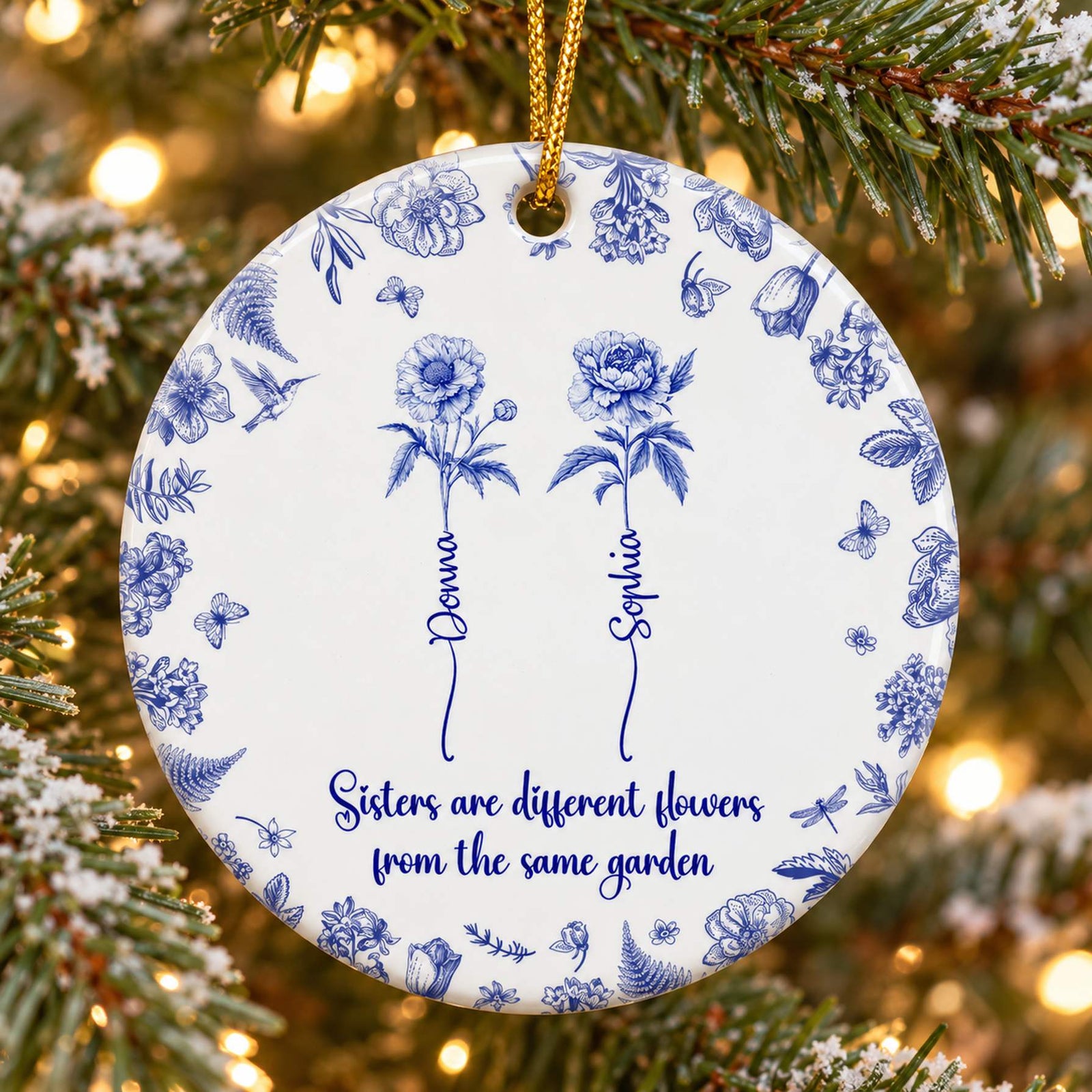 Close-up detail of blue Toile de Jouy floral print and personalized stem names on ceramic ornament