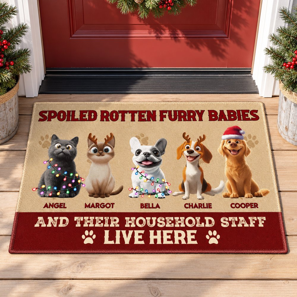 Spoiled Pets Live Here personalized Christmas doormat on a festive holiday porch with pine decor