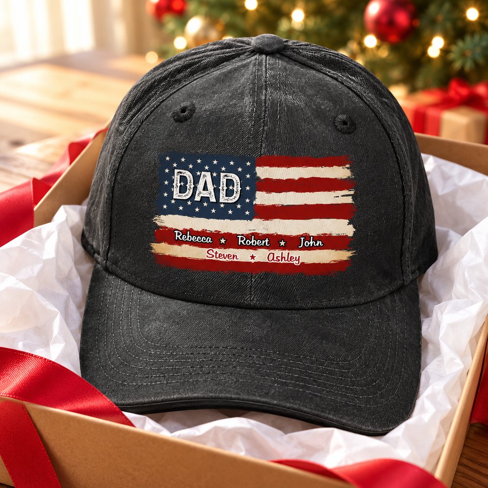 Personalized DAD American flag washed denim cap in a holiday gift box near Christmas tree