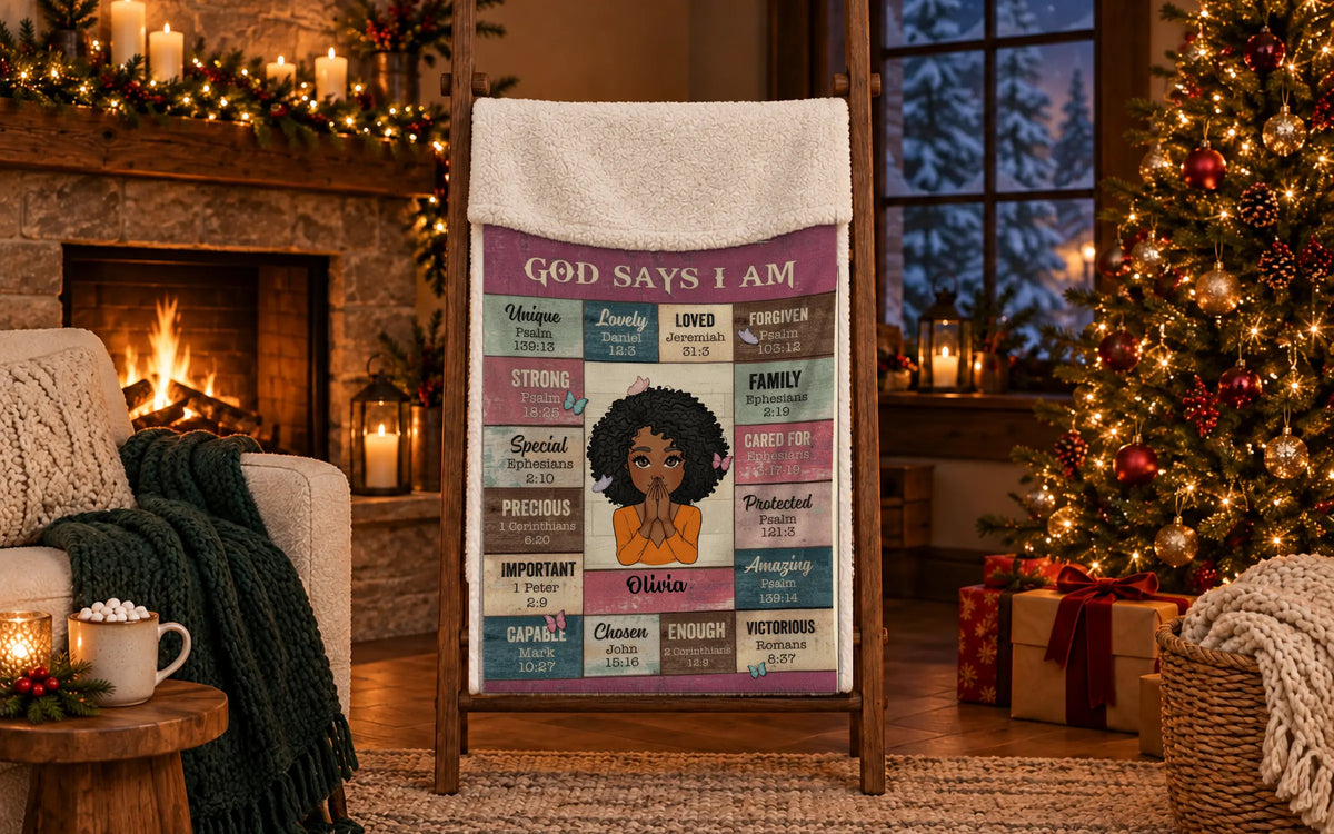 Personalized God Says I Am blanket hanging on a wooden ladder in a cozy Christmas living room