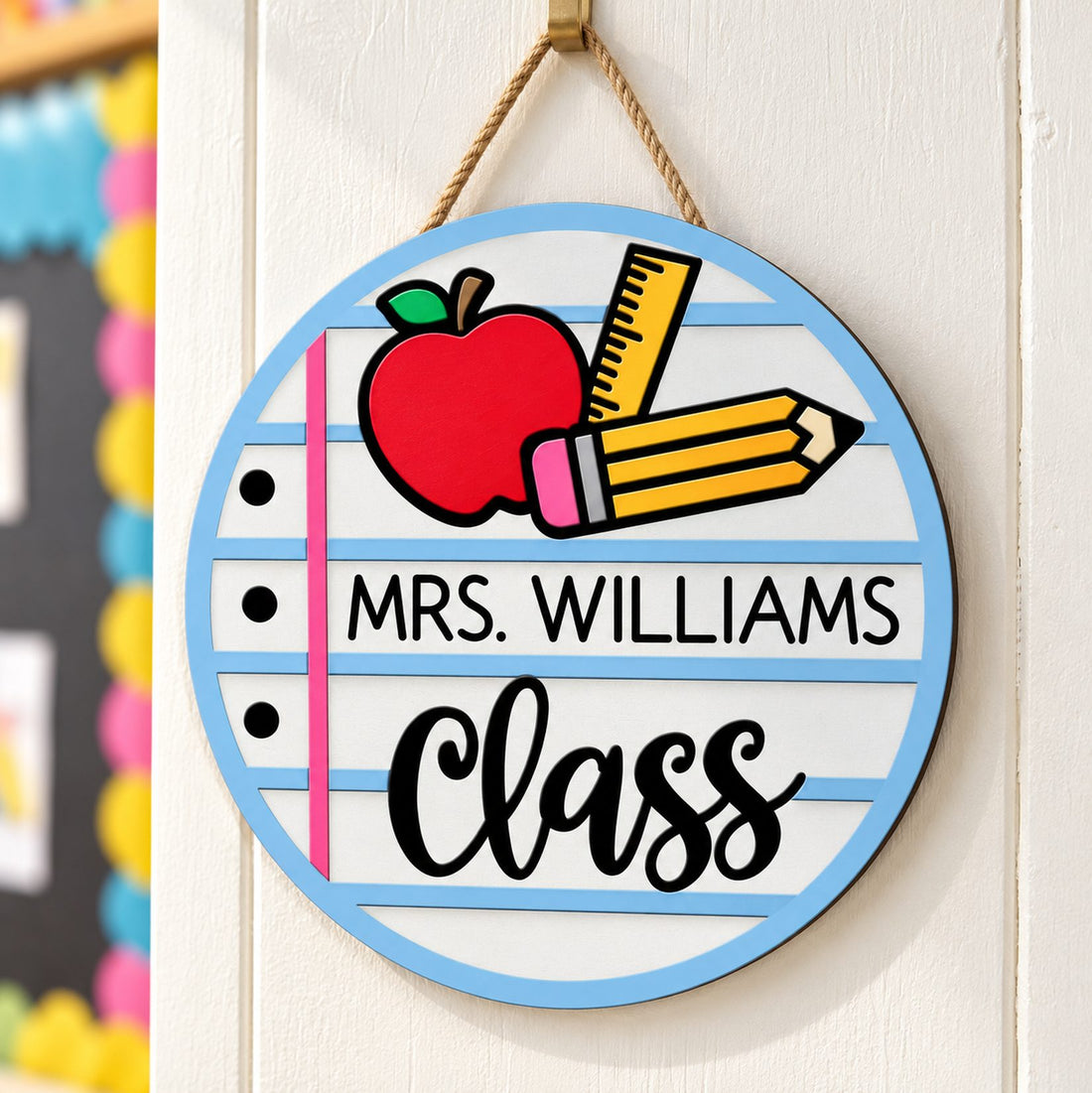 Personalized Mrs. Williams Class round wood sign hanging on a bright classroom wall