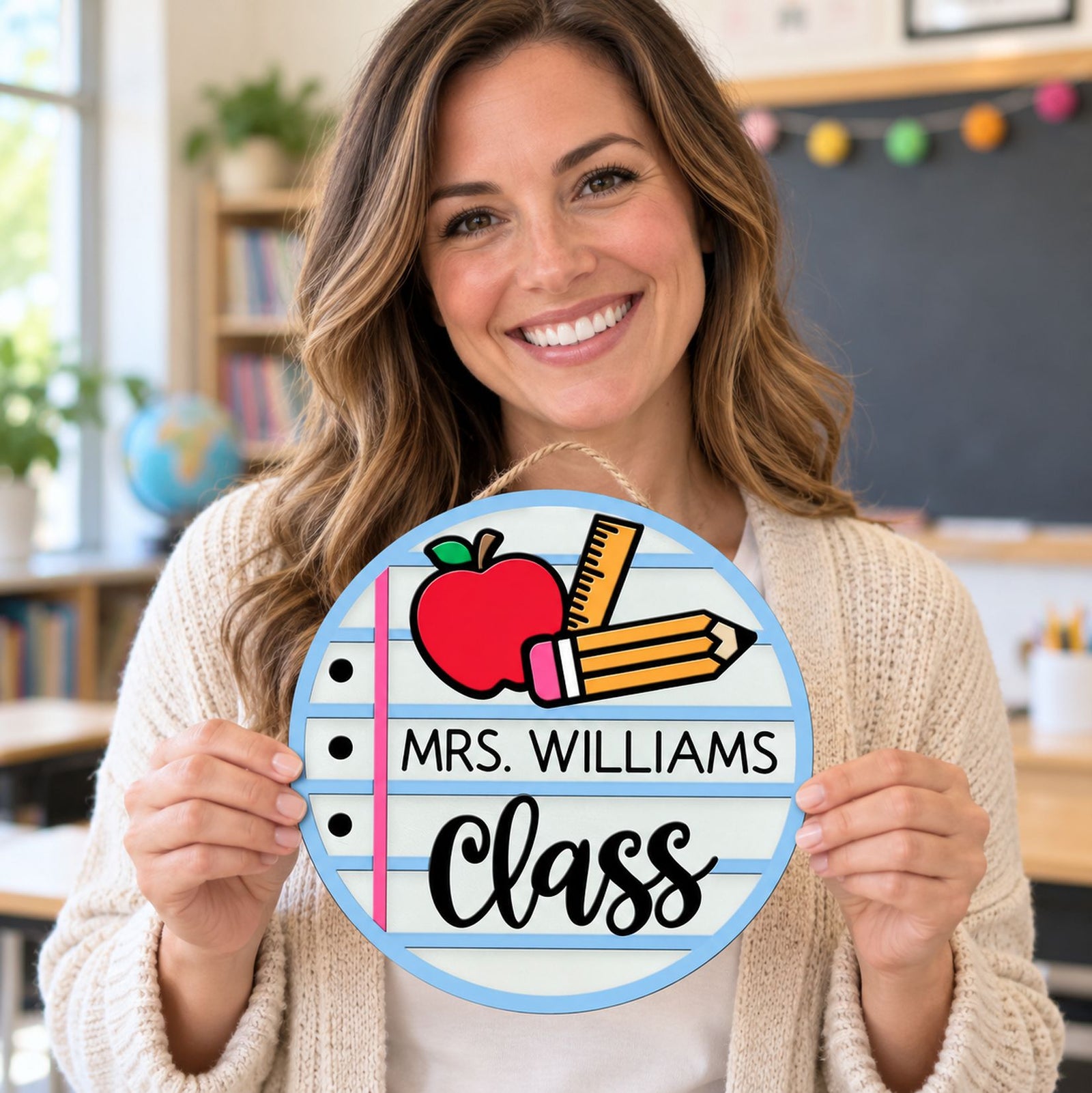 Happy female teacher holding her personalized Mrs. Williams Class round wood sign
