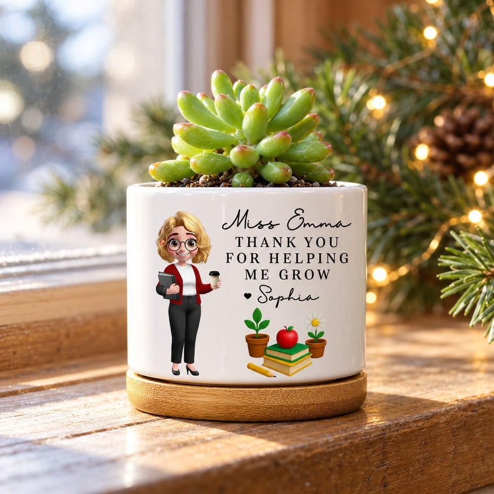 Personalized teacher ceramic plant pot Miss Emma variant on windowsill with soft holiday greenery