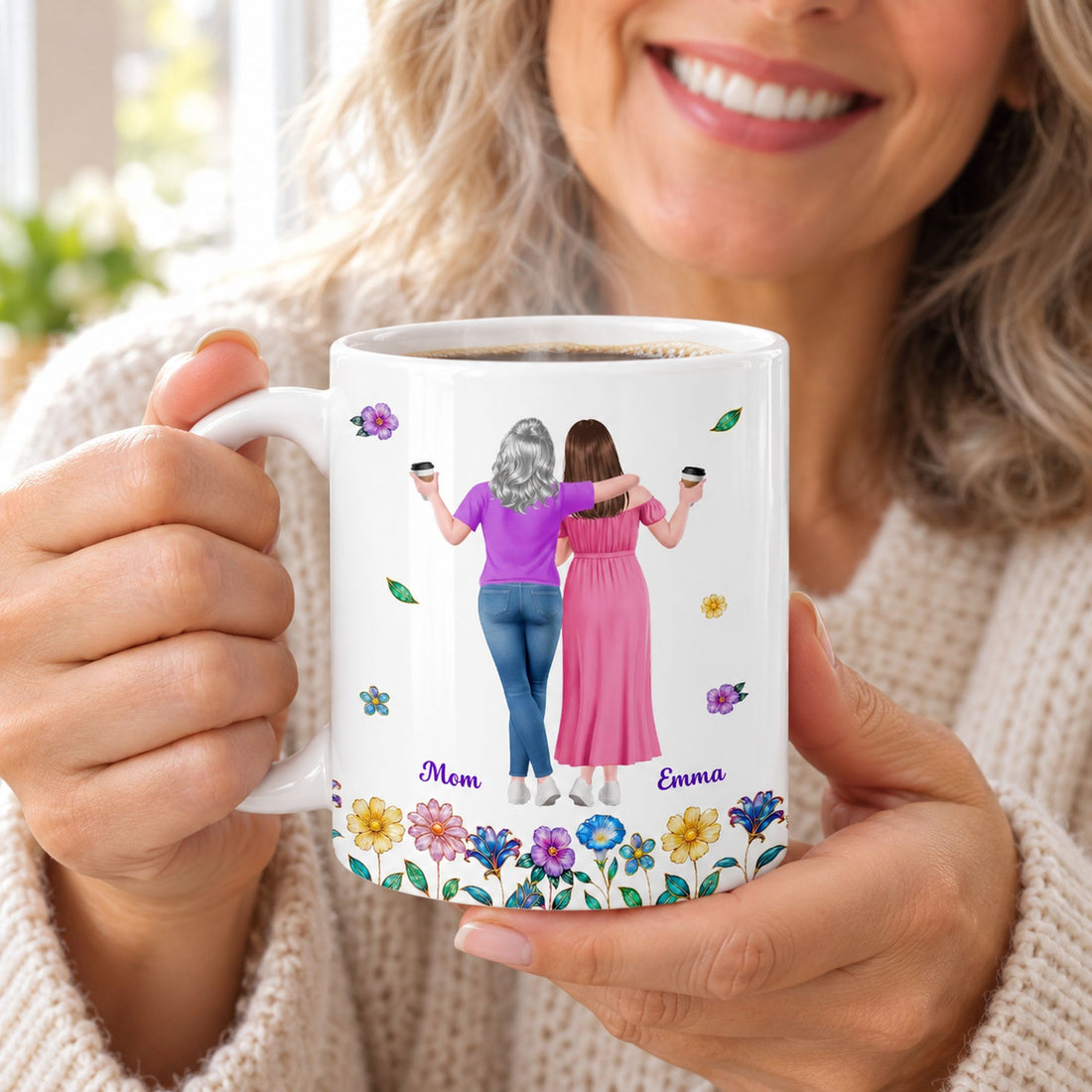 Smiling mom holding personalized mother daughter coffee mug with steam