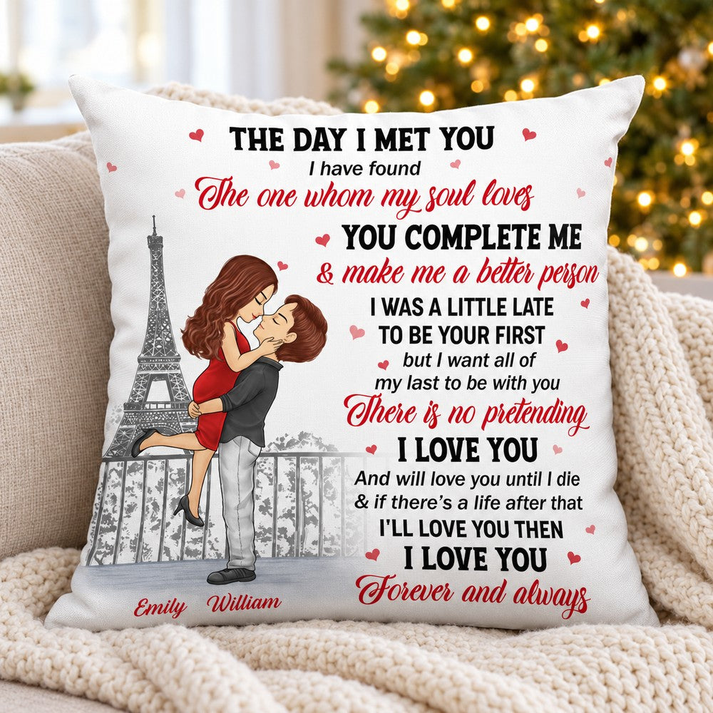 Personalized couple throw pillow on a cozy holiday sofa with Christmas tree lights