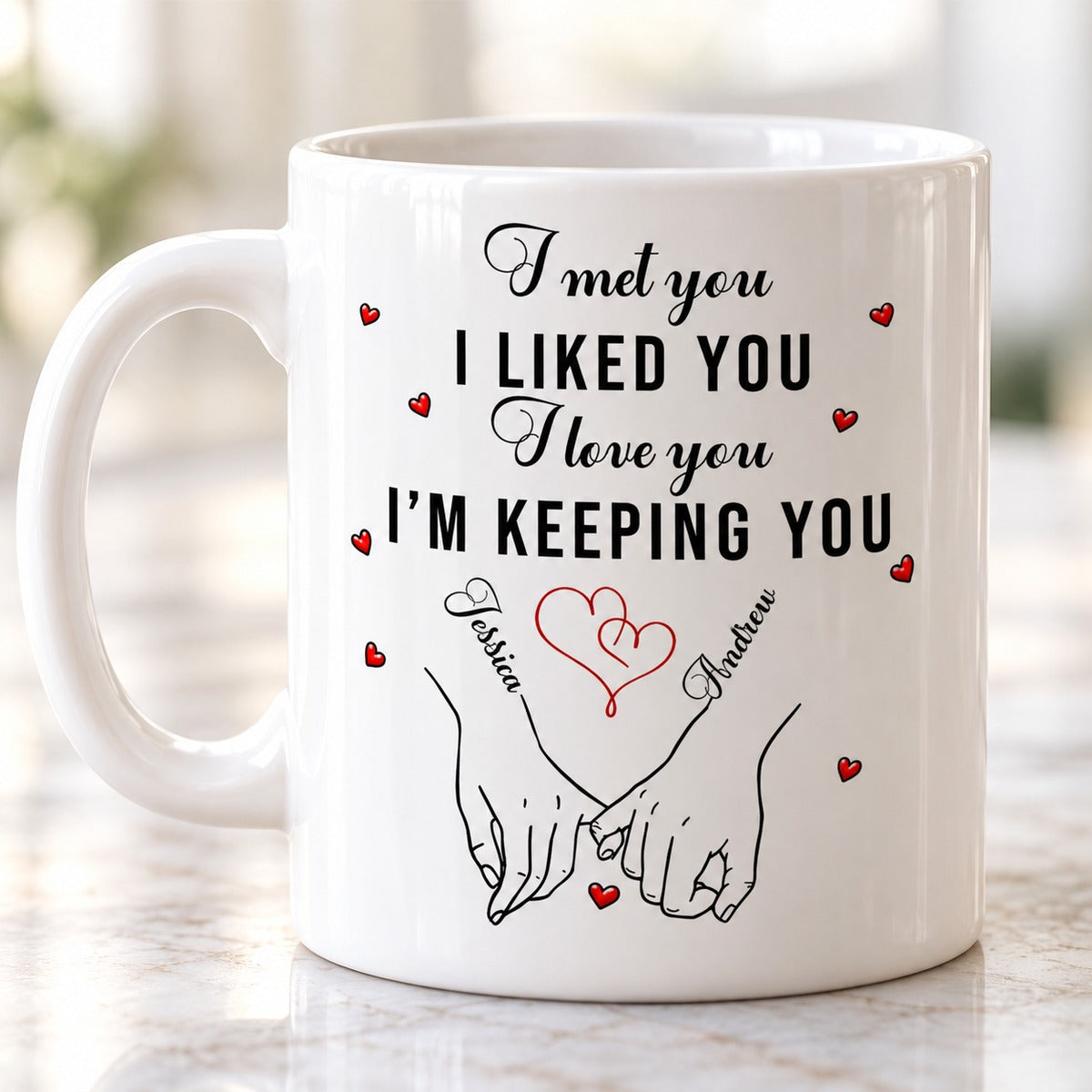Close-up detail of pinky swear hands and custom names on white ceramic mug