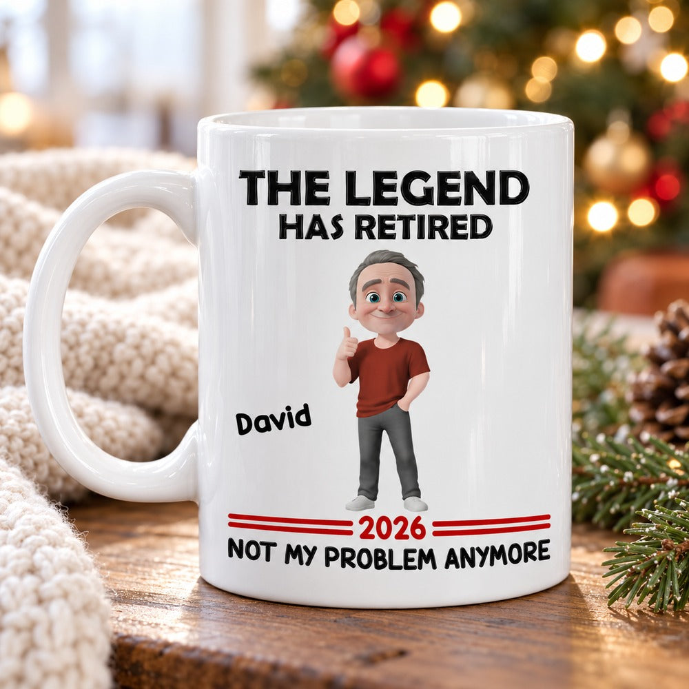 Personalized retirement mug on wooden table with pine greenery and Christmas tree