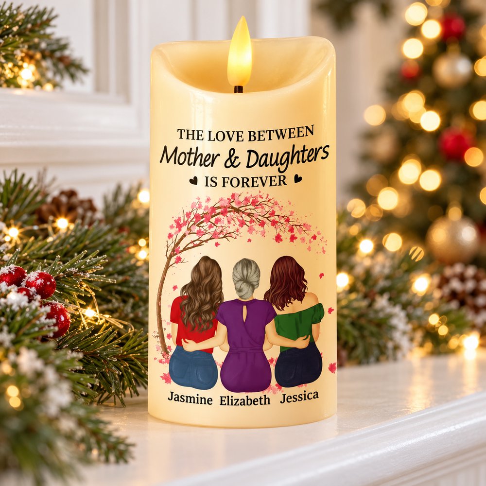 Personalized Mother and Daughters LED candle glowing on a holiday mantel with pine decor
