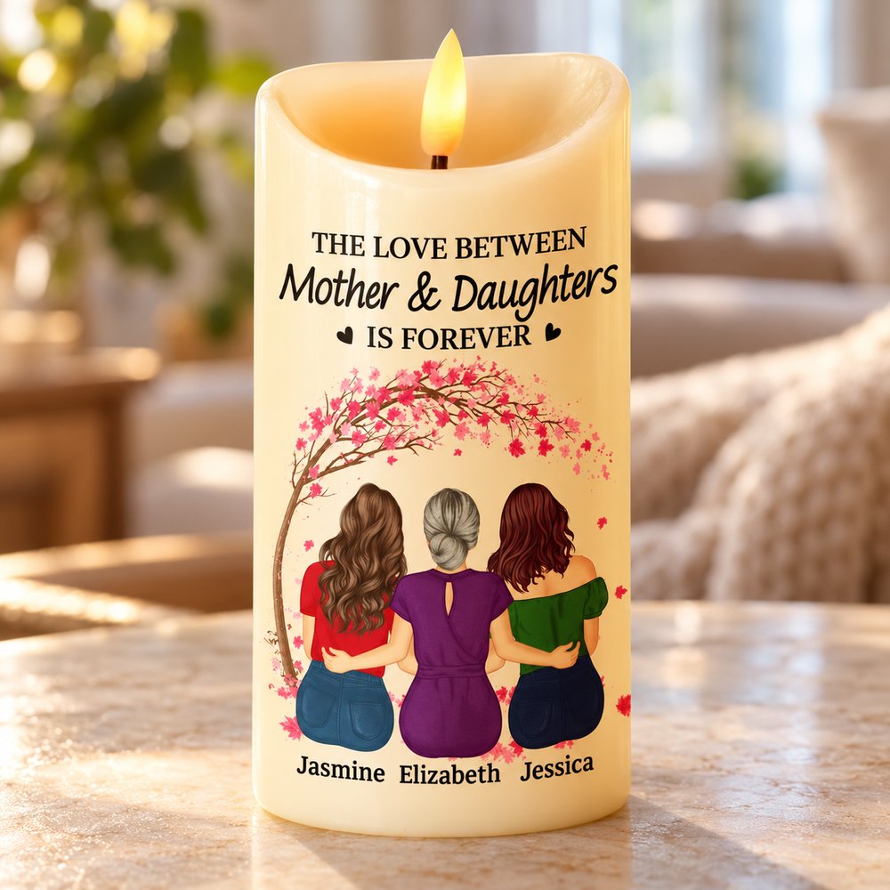 Close-up of printed Mother and Daughters illustration and LED flame on custom candle