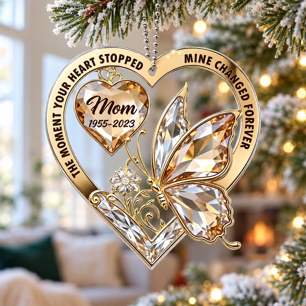Mom memorial acrylic ornament hanging on a Christmas tree branch in a bright holiday setting