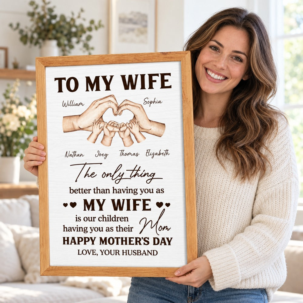 Wife holding her personalized Mother's Day framed canvas print from husband