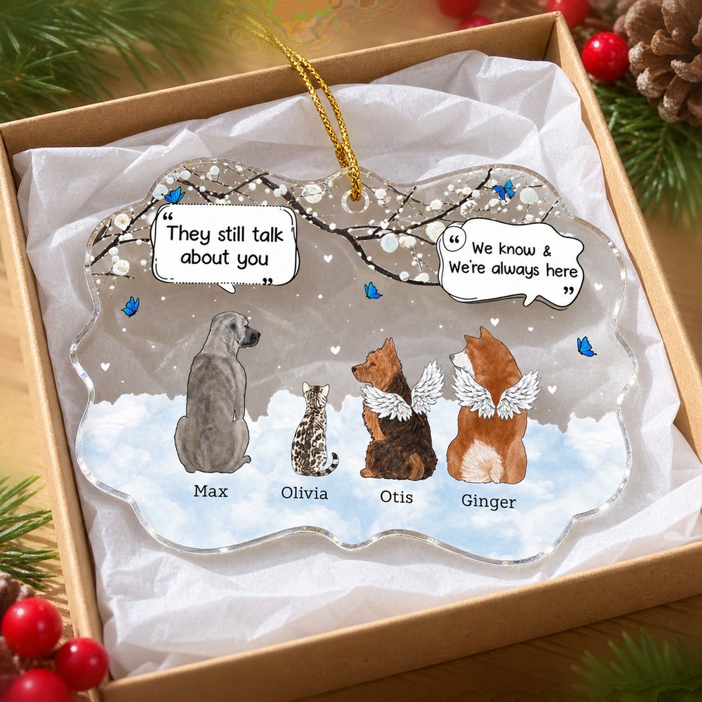 Personalized pet memorial acrylic ornament in an open holiday gift box with ribbon and pine sprigs