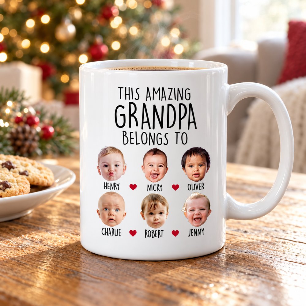 Custom Grandpa mug with grandkids faces on wooden table near Christmas tree