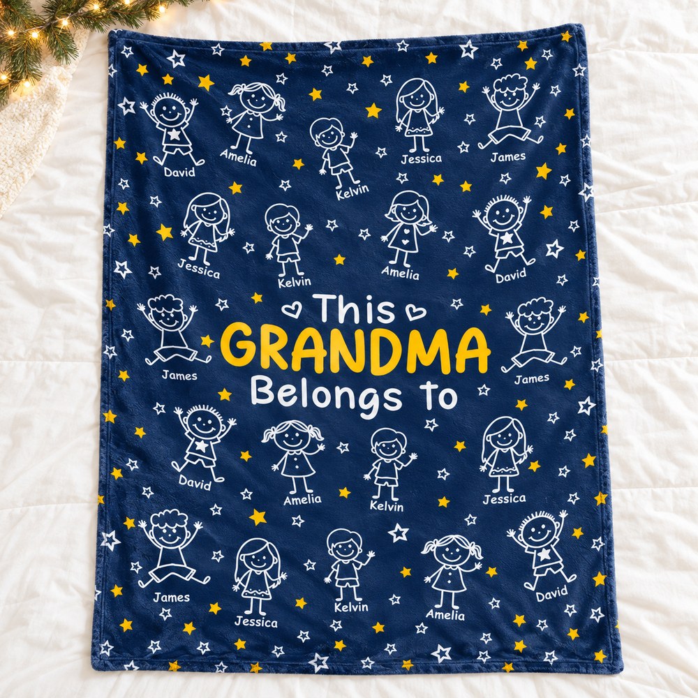 Personalized Grandma fleece blanket spread flat on bed with holiday garland
