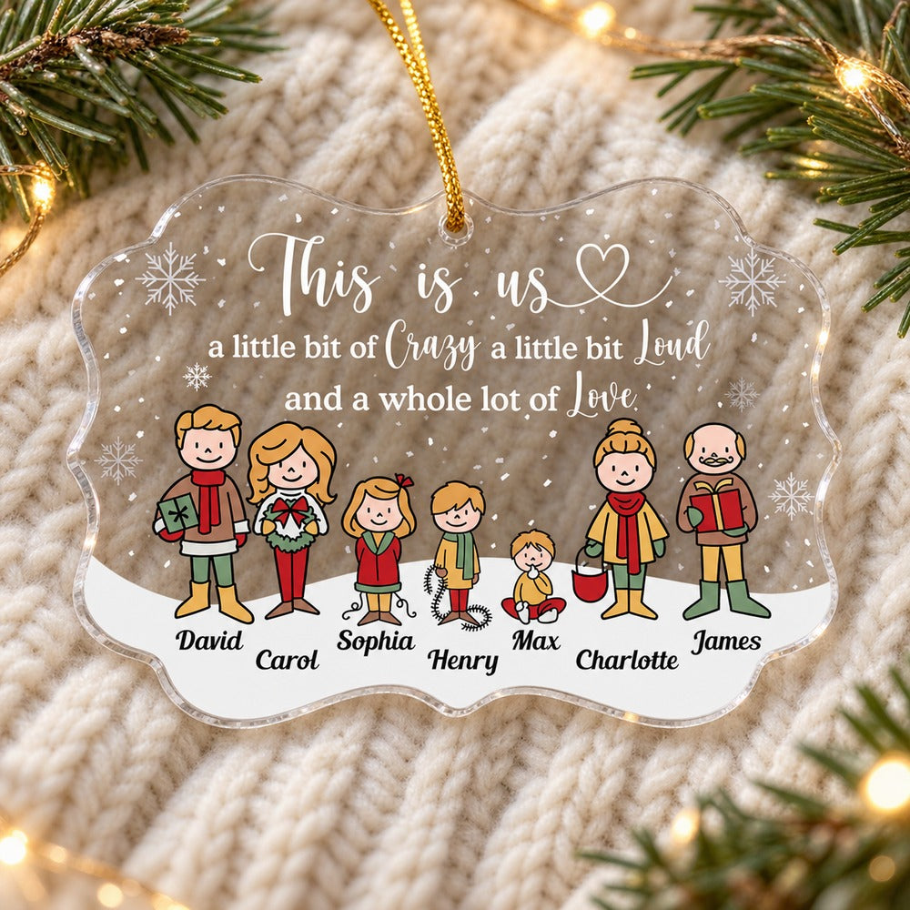 Personalized This Is Us medallion acrylic family ornament lying flat on a cozy knit blanket with pine greenery