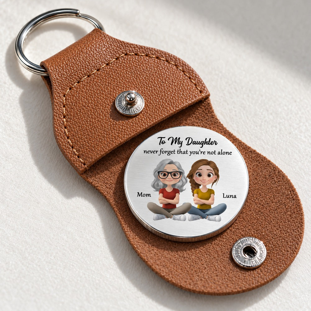 Macro closeup of personalized stainless steel pocket hug coin print and brown leather texture