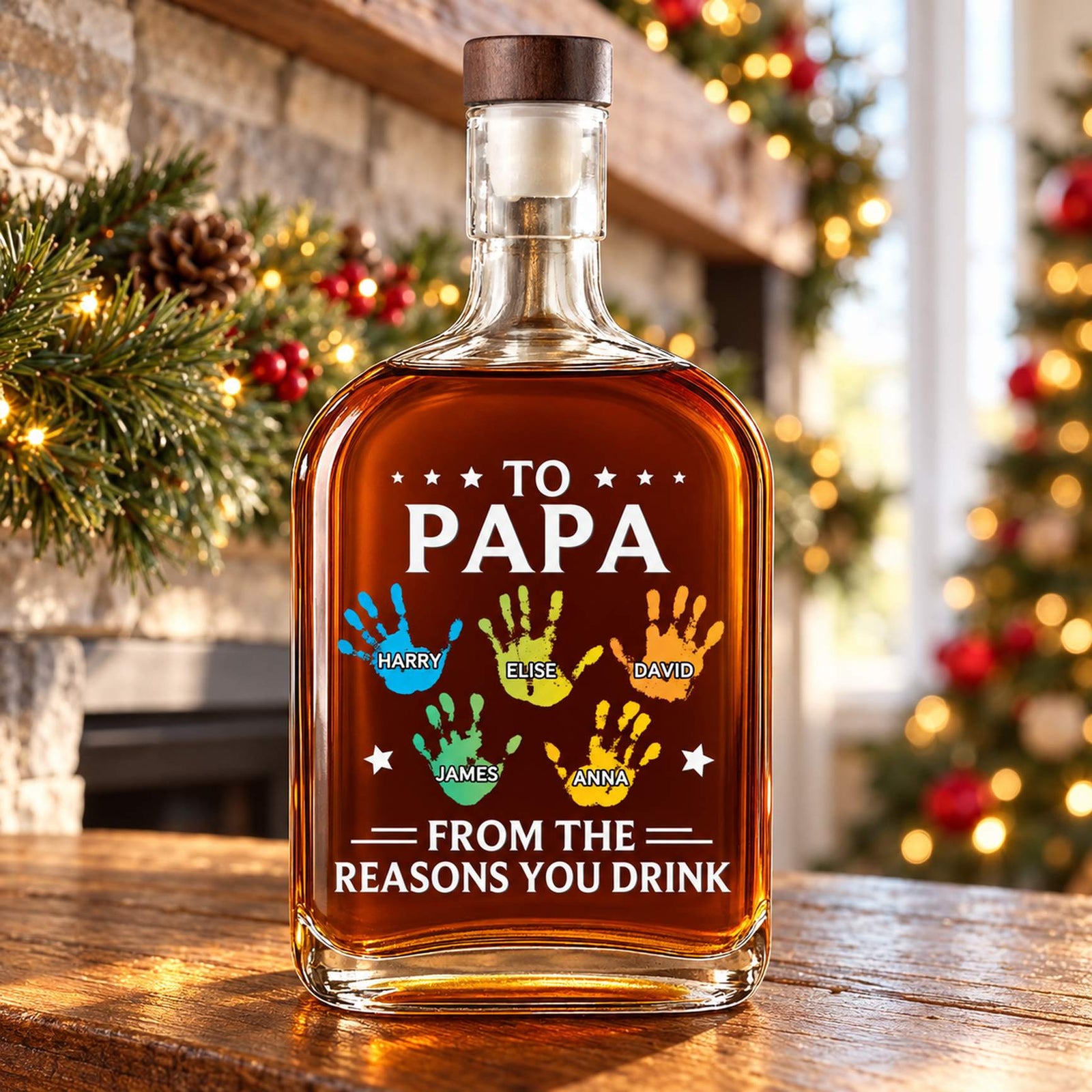 Personalized To Papa whiskey bottle with kids handprints on a festive Christmas mantel