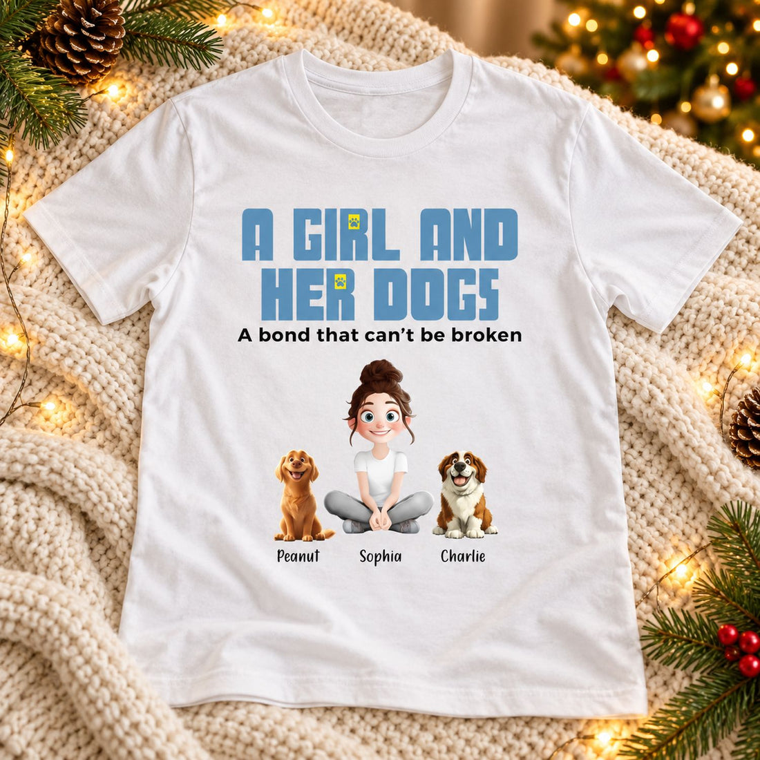 Personalized dog mom shirt laid flat with Christmas greenery and lights