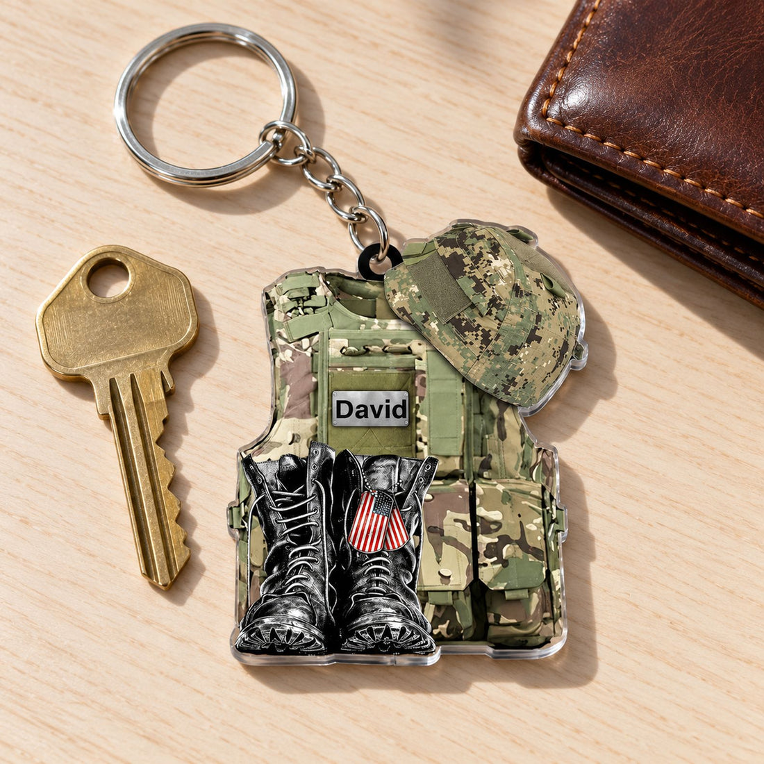 Military uniform acrylic keychain next to a house key and wallet showing real size