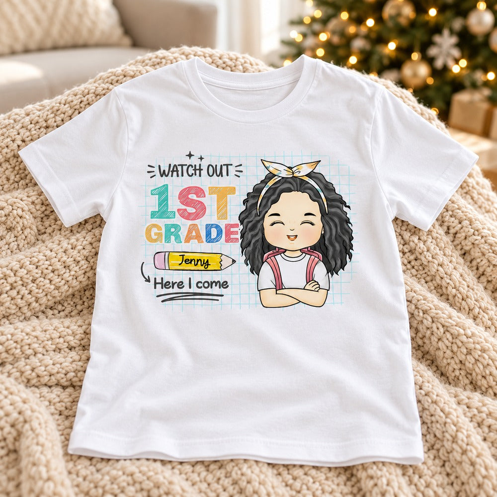 Personalized back to school kid shirt laid flat near a holiday Christmas tree