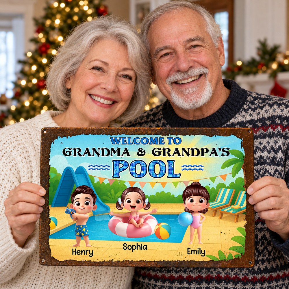 Grandma and Grandpa holding personalized Welcome to Pool metal sign in front of a Christmas tree