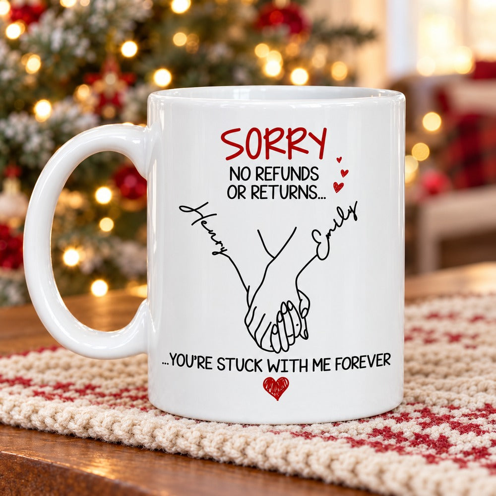 Personalized couple mug on wooden table with soft holiday tree background