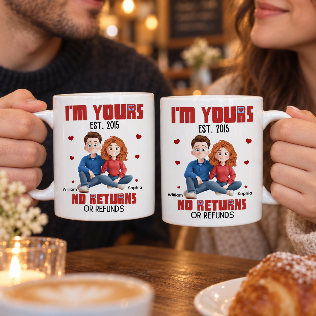 Couple holding personalized I'm Yours No Returns cartoon couple mugs in a cafe