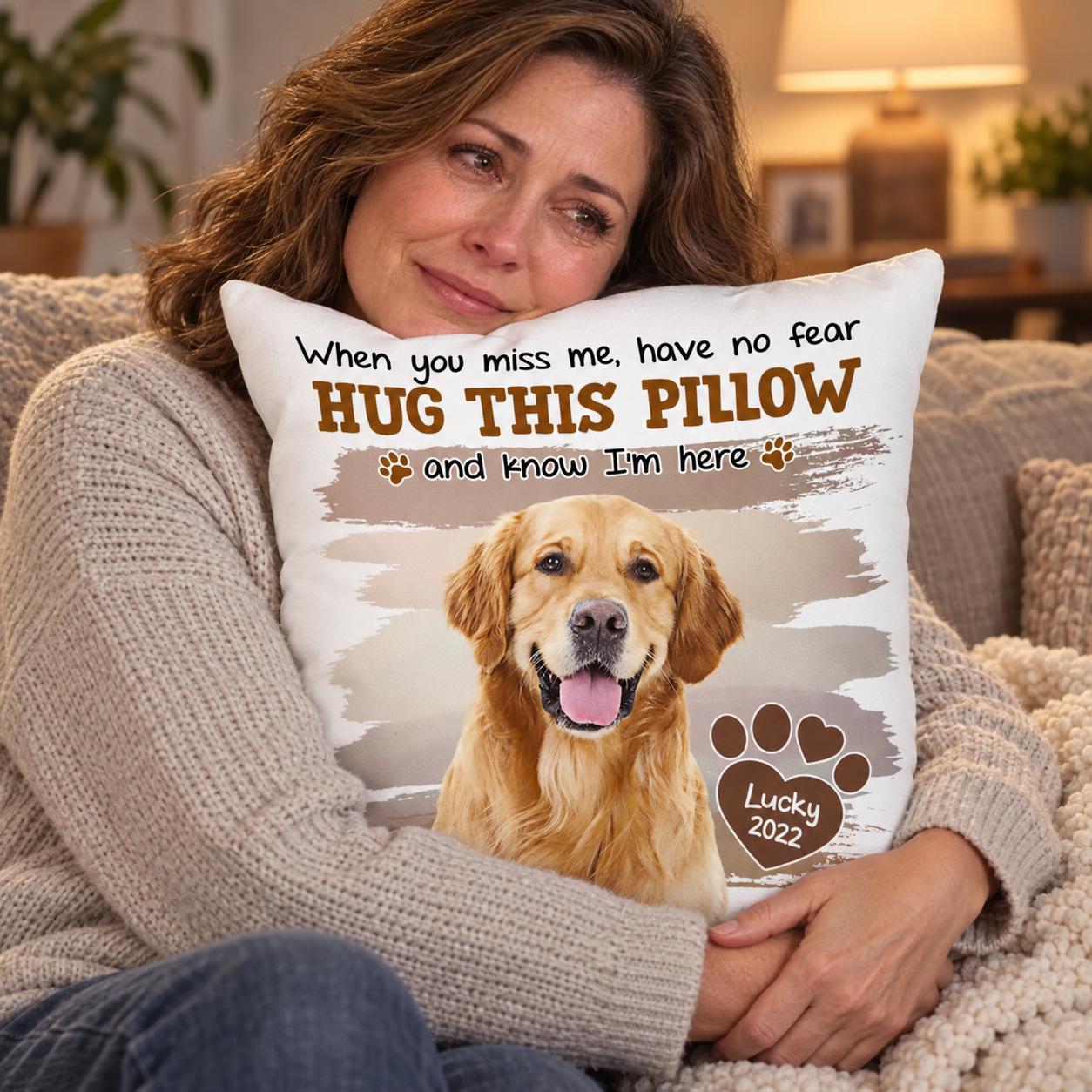 Woman hugging a custom pet photo memorial pillow on a sofa for comfort