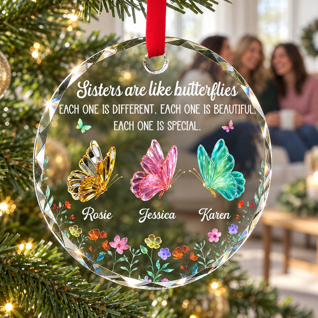 Personalized Circle Glass Ornament for Sisters hanging on a bright green Christmas tree branch.