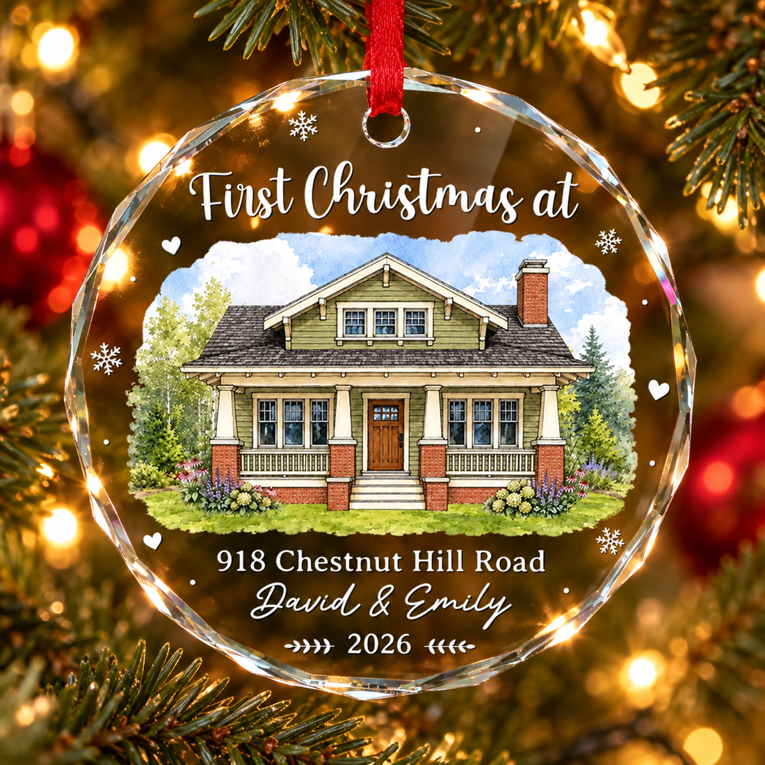 Personalized First Christmas at new home glass ornament hanging on a lit Christmas tree