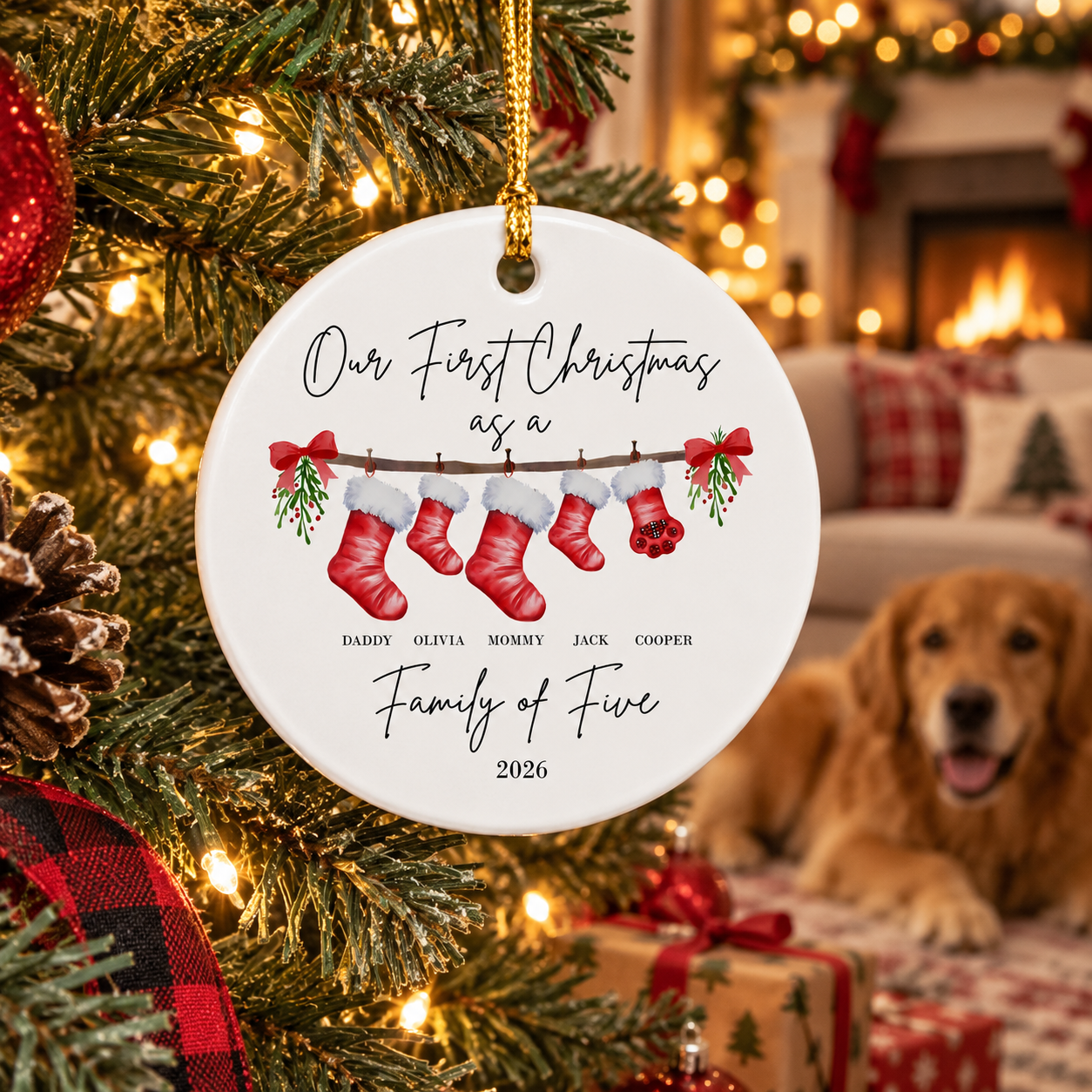 Personalized family of five with pet ceramic Christmas ornament on a tree with a dog nearby