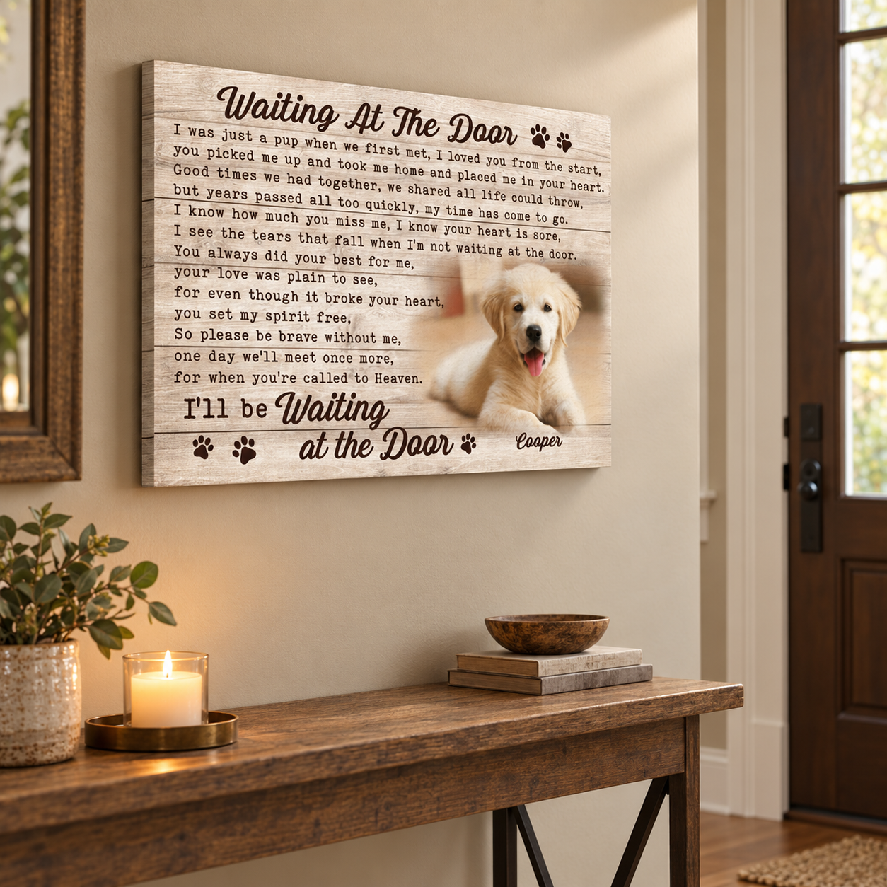 Custom pet memorial canvas hung in an entry hallway beside a console table and candle